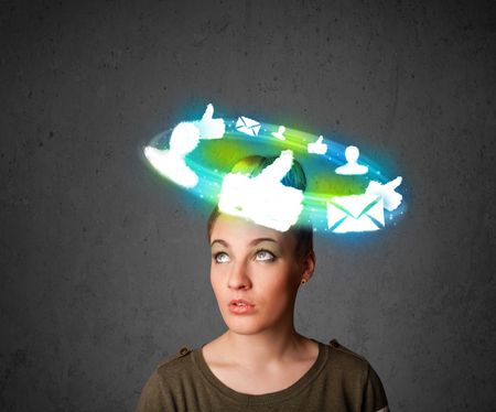 Teenager with cloud social icons around her head 