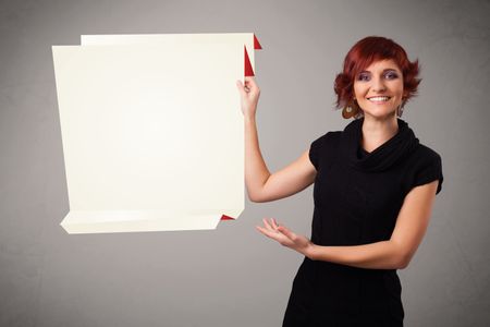 Baeutiful young woman holding white origami paper copy space