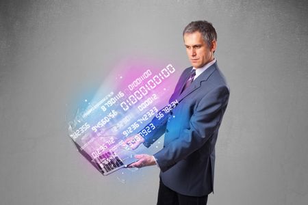 Attractive businessman holding notebook with exploding data and numbers