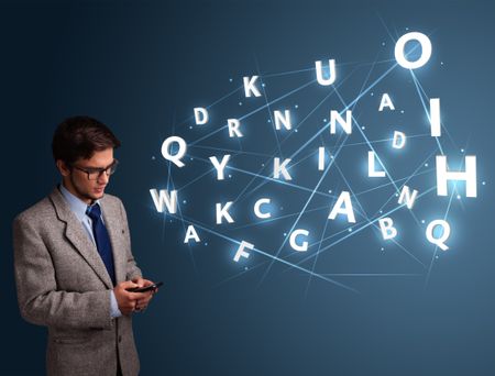 Handsome young man typing on smartphone with high tech 3d letters comming out