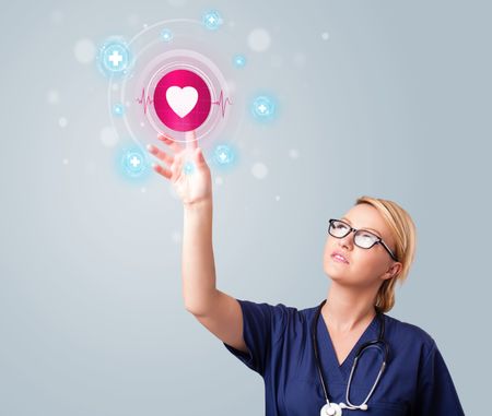 young-nurse-standing-pressing-modern-medical-232369666 Young nurse standing and pressing modern medical type of buttons