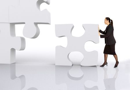 asian business woman building a puzzle over a white background