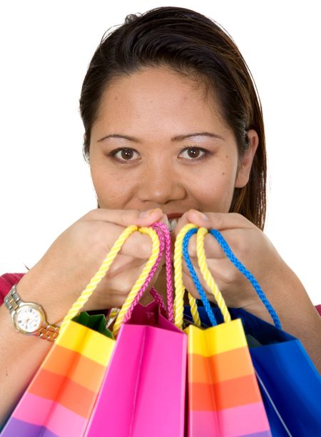 asian girl with shopping bags over a white background