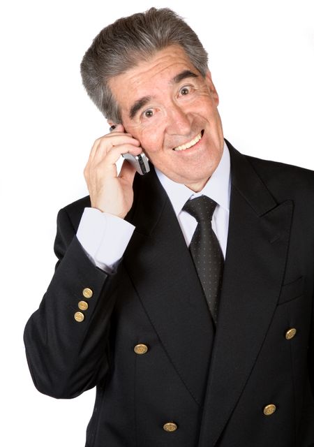 senior business man on the phone over a white background