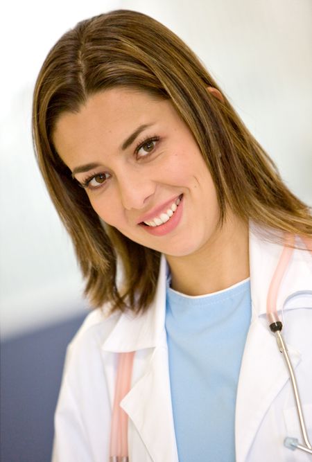 Portrait of a friendly female doctor smiling at the hospital