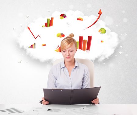 Beautiful young businesswoman with cloud in the background containing colorful graphs and diagrams