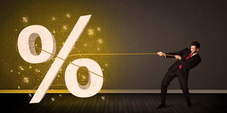 Business man pulling rope with big procent symbol sign concept on background