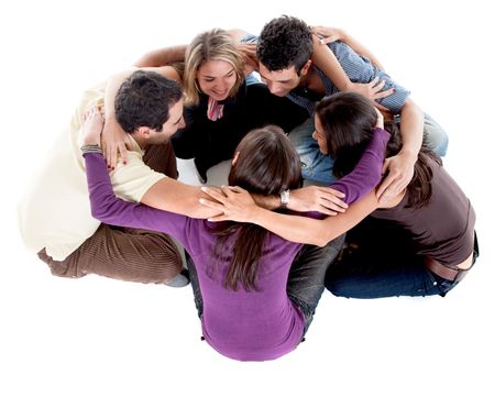 Casual group of friends sitting on the floor isolated on white