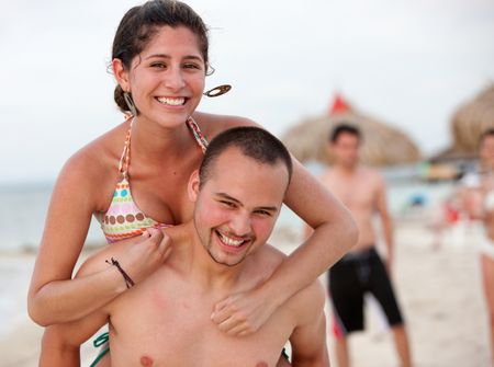 happy beach couple smiling and having fun