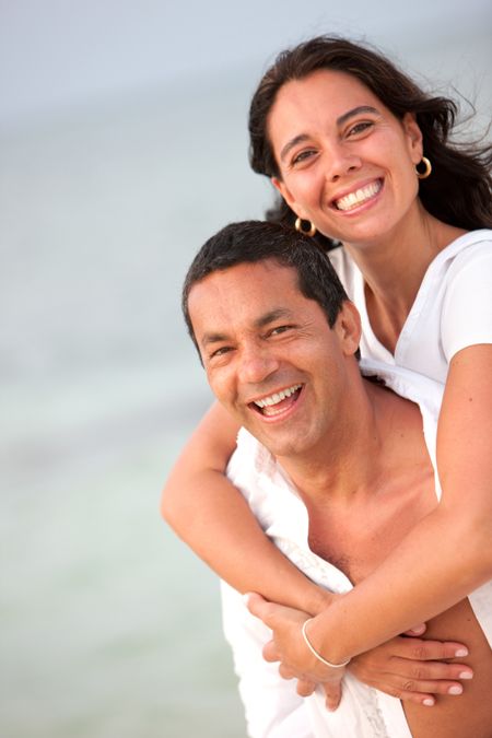 Portrait of a loving couple enjoying their vacations on the beach