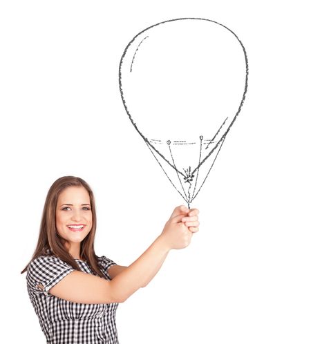 Pretty young woman holding balloon drawing