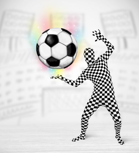 Funny man in full body suit holdig soccer ball