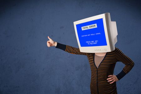 Person with a monitor head and fatal error blue screen on the display