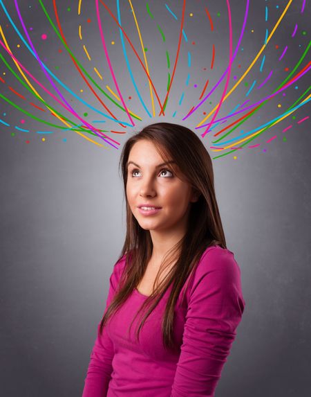 Pretty young girl thinking with colorful abstract lines overhead