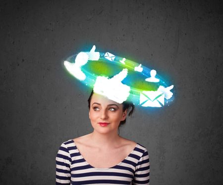 Teenager with cloud social icons around her head