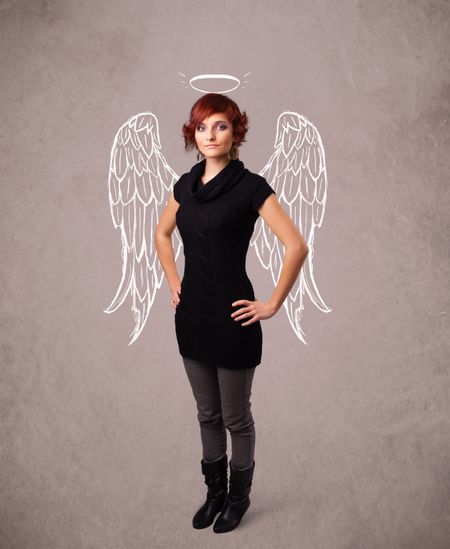 Cute girl with angel illustrated wings on grungy background