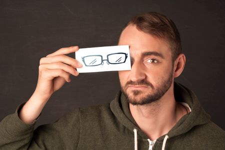 Happy guy looking with paper hand drawn eye glasses concept