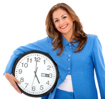 beautiful business woman smiling with clock under her arm- isolated over a white background