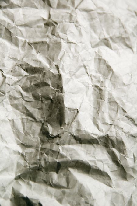 Hidden face in wrinkled wrapping paper