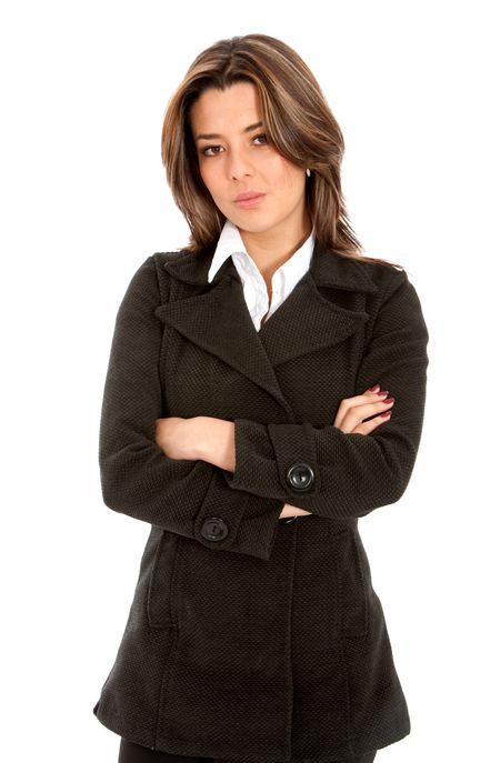 Businesswoman standing with her arms crossed isolated over white