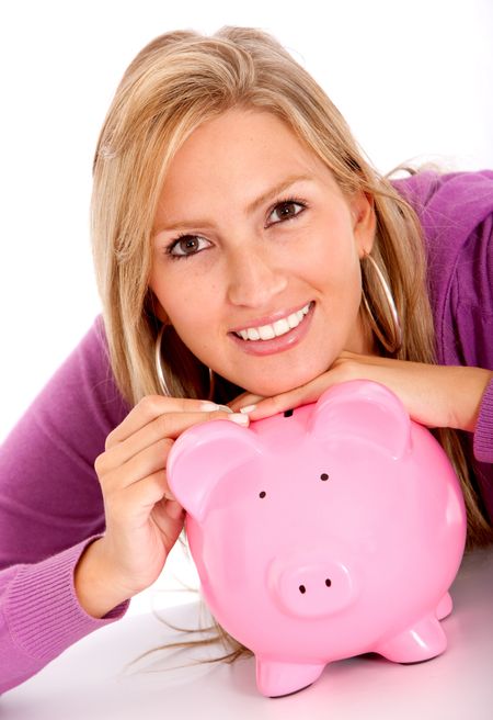 business woman looking at her savings in a piggy bank isolated on white