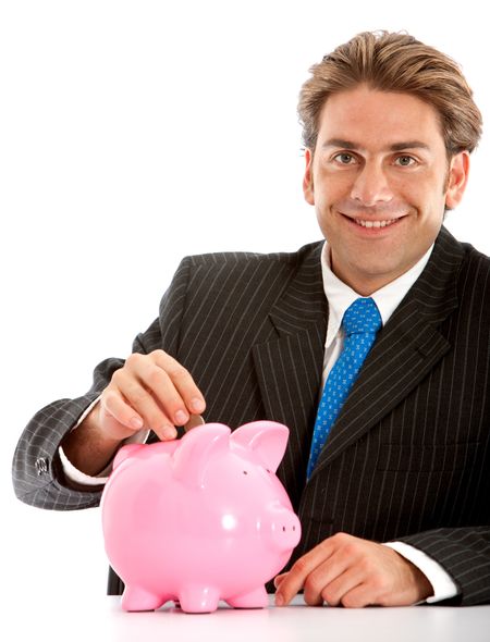 businesman putting his savings in a piggy bank - isolated