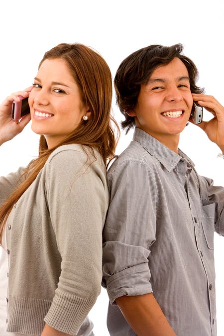 Young couple talking on the phone isolated on white