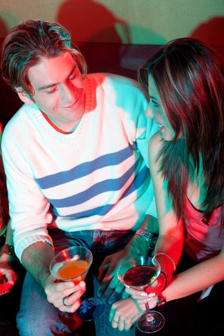 couple in a bar having a drink and talking