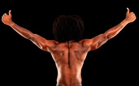 Strong back of a black muscular man isolated on black