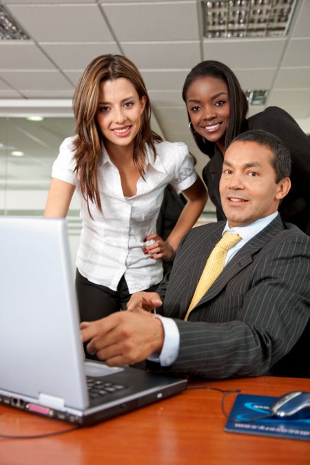 small business team in a meeting on a laptop computer in an office