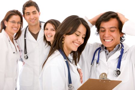 Very happy group of doctors isolated over a white background