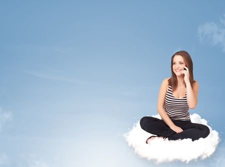 Beautiful young woman sitting on cloud with copy space