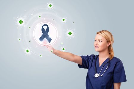 Young nurse standing and pressing modern medical type of buttons