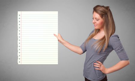 Pretty young lady holding white paper copy space with diagonal lines