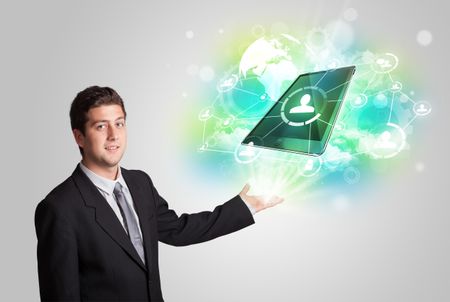 Business man showing modern green tablet technology concept