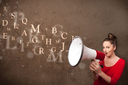 Young girl shouting into megaphone and abstract text come out