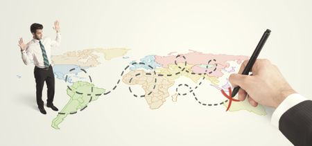 Businessman looking at map and route drawn by hand concept on background