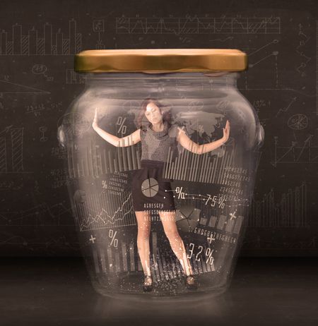 Businesswoman traped in jar with graph chart symbols concept on background