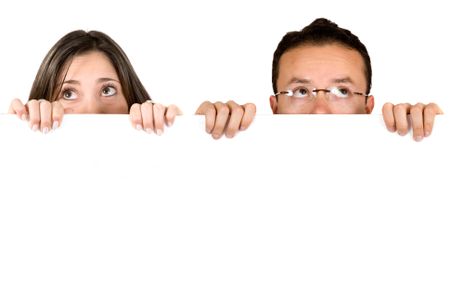 couple holding a white card over a white background