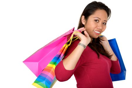 asian girl with shopping bags over a white background