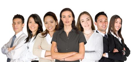 business woman facing the camera in a green blouse with her team behind over white