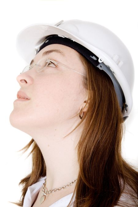 beautiful female engineer looking up in a pensive expression over a white background