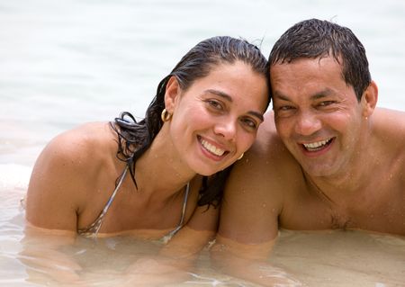 Loving couple enjoying their holidays on the beach
