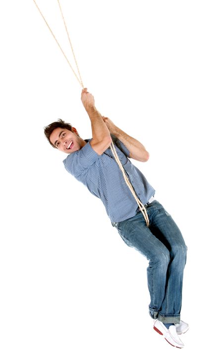 Casual man jumping with a rope isolated over a white background