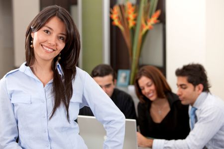 Portrait of a business woman in an office smiling