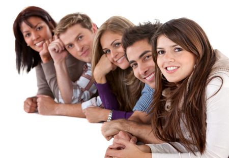 group of friends on the floor leaning on their hands - isolated over a white background