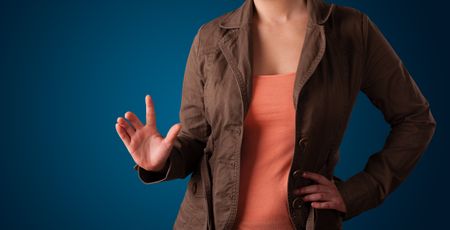 Young woman pressing imaginary button