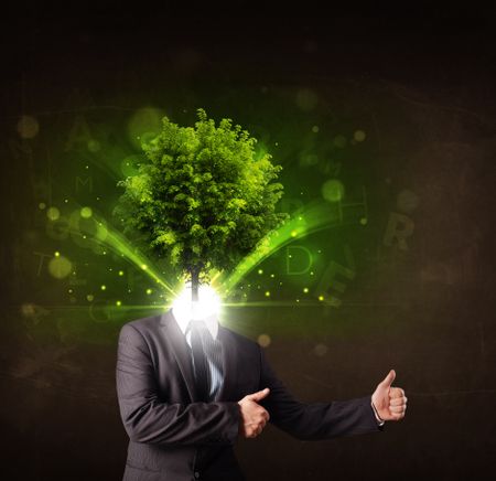 Man with green tree head concept on brown background