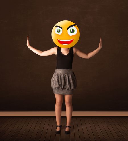 Funny businesswoman with yellow smiley face
