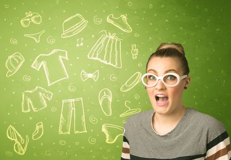 Happy young woman with glasses and casual clothes icons concept on green background